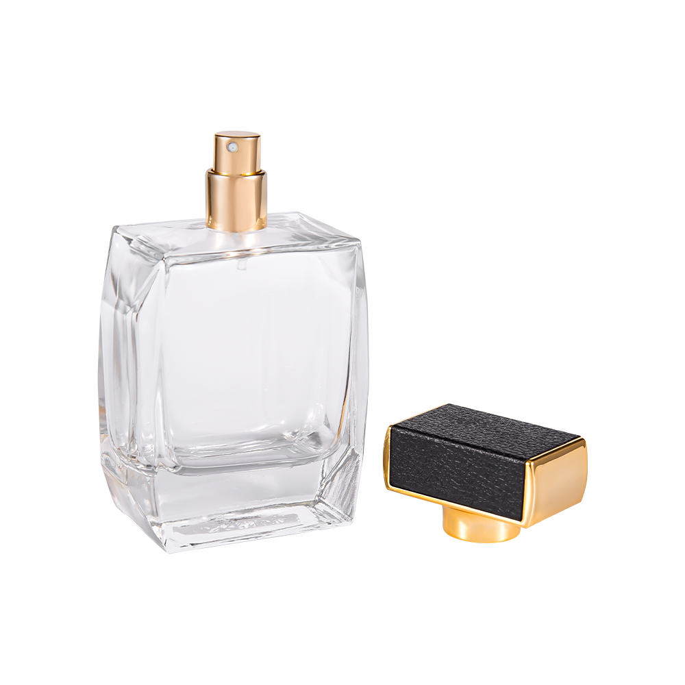 KY1092-WJ2092 Flacon de parfum din sticlă transparentă de 100 ml, cu capac din piele din plastic și părți placate cu aur UV